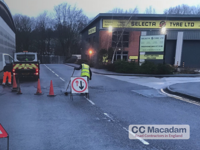 Tarmac Contractors repairing road on business park